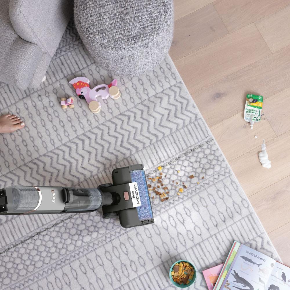 Vacuums, mops & cleans itself at the same time